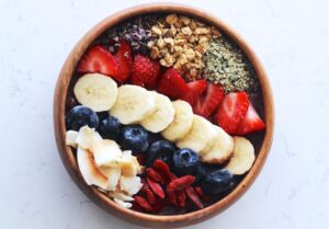 Fresh fruit ingredients for smoothies – strawberry, banana, and blueberries